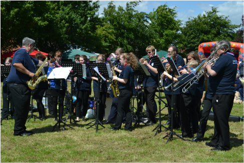 Oadby and Wigston Scout and Guide Band performing at a fete